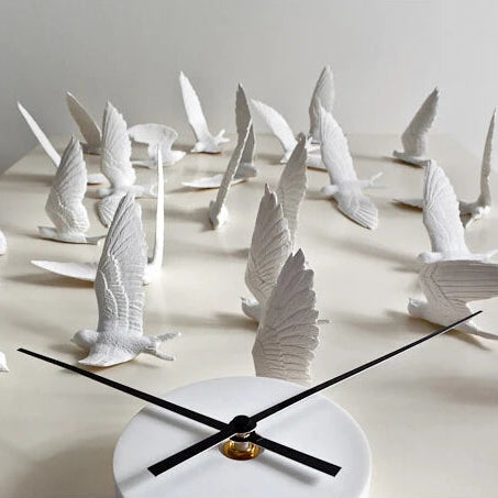 Decorative kitchen wall clocks - Darven features sculpted white birds as hour markers around a simple round clock, ideal for enhancing the style of an open kitchen wall.