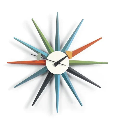 Rovell features a small round face with simple hands and colorful spokes, embodying mid-century modern style, perfect for adding a classic touch to your home decor.