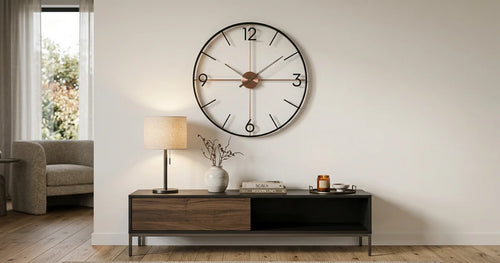 Large modern wall clock perfectly scaled above console table in elegant living room