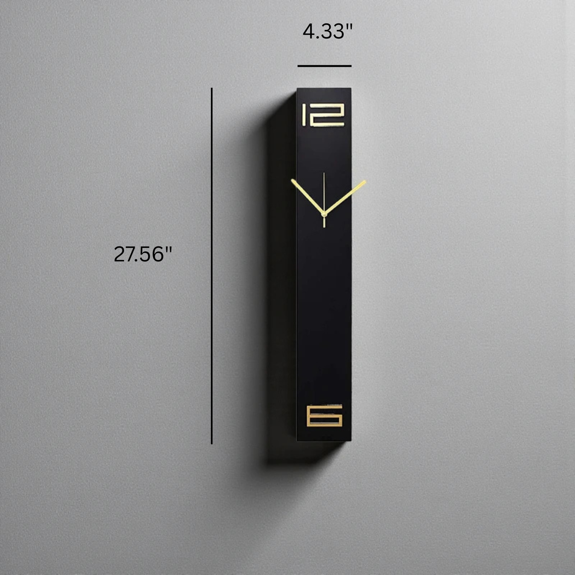 Modern long wall clocks - Rowell: A tall, narrow matte black clock with minimalist gold-tone hands and numerals 12 and 6, perfect for adding a sculptural touch to any space.