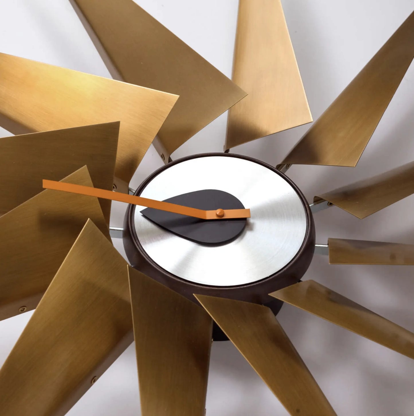 Decorative wall clock with gold on a white background