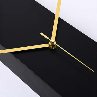 Modern long wall clocks - Rowell: A minimalist clock featuring slim gold hands on a matte black block, transforming wall spaces into silent, functional art, embodying The Horologista's refined timepiece collection.