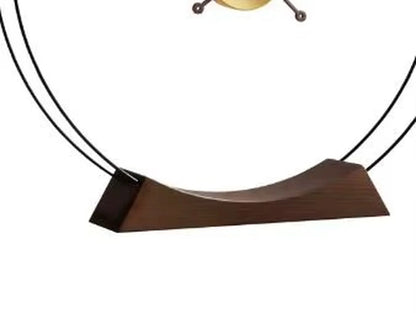 Design table clock - Bexley: A minimalist wooden base supports two thin metal rods, elegantly arching to hold the clock, embodying contemporary style and sophistication, perfect for adding an artful touch to any space.