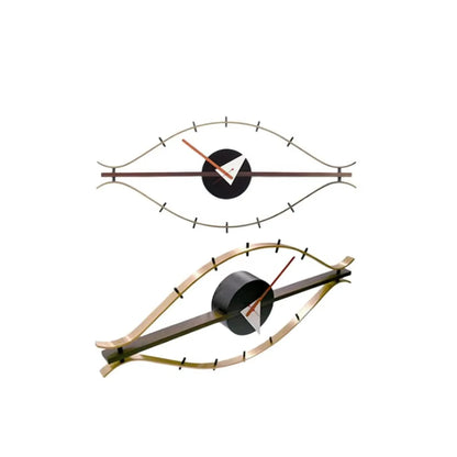 30-inch decorative wall clock - Ashen, features a mid-century-modern eye shape with gold-tone frame, red and white hands, and black tick-marks, exemplifying The Horologista’s blend of industrial style and vintage charm.