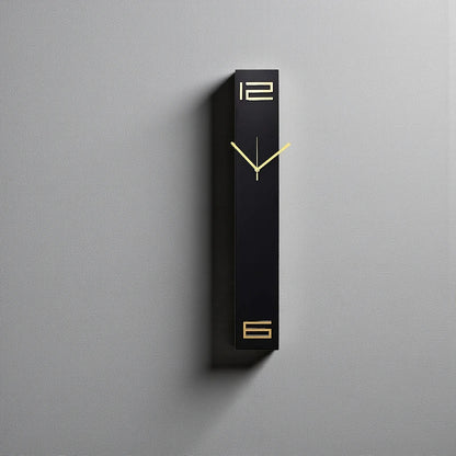 Modern long wall clocks - Rowell: A minimalist black rectangular clock with gold hands and numerals, mounted on a light-gray wall, blending functionality with art. Perfectly silent, it's a sleek addition to any space.