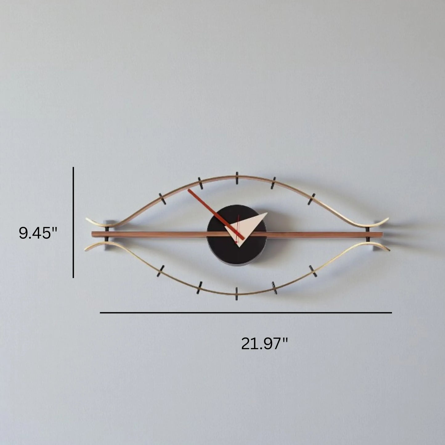 30-inch decorative wall clock - Ashen features an eye-shaped silhouette with brass rods as eyelids, a black clock body, white and red hands, exemplifying industrial style and vintage charm.