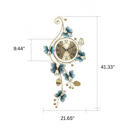 Hanging Wall Clock - Elmsford features a gold-tone metal frame with twisting vines and leaves, accented by blue butterflies and flowers, surrounding a champagne-gold dial with black numerals.