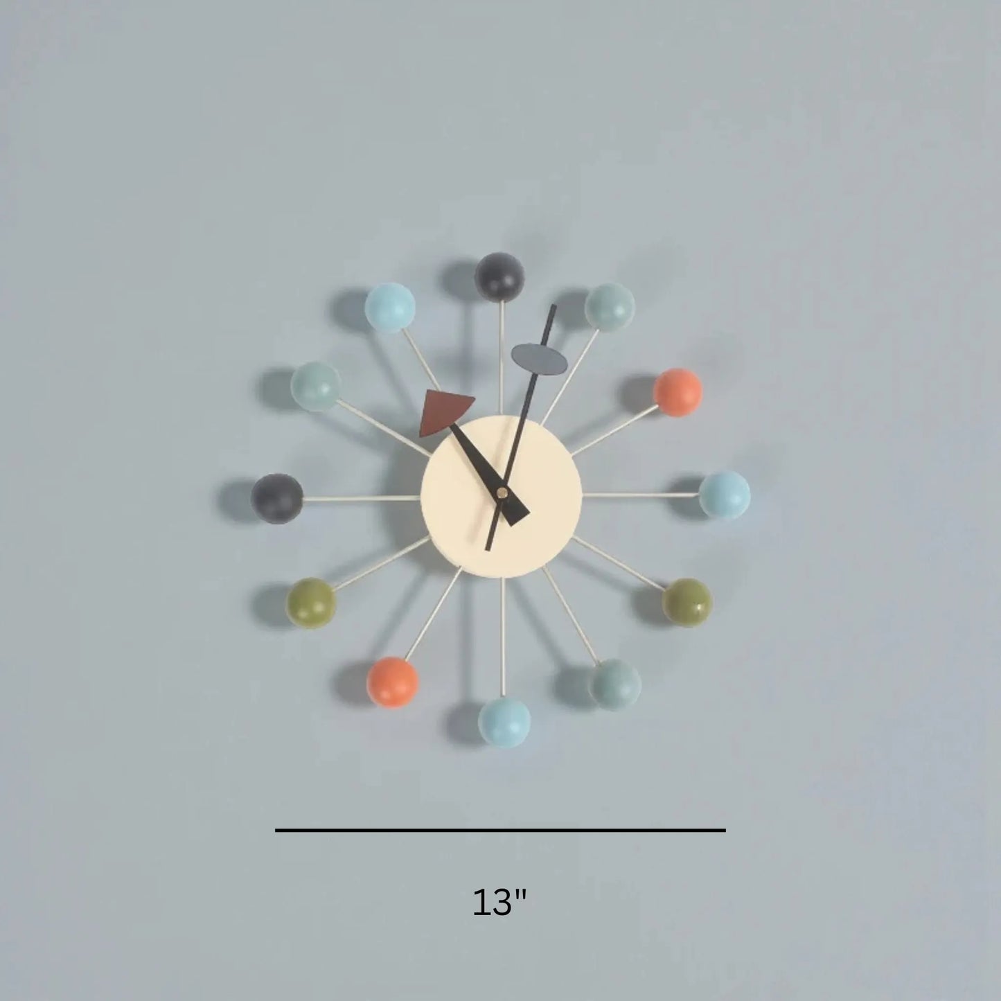 Back view of decorative clock showing battery compartment and mounting hook