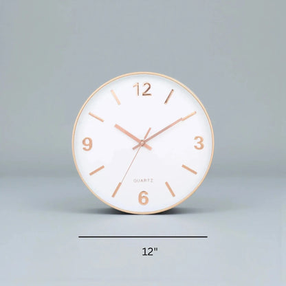 Modern Silent Wall Clock - Densford: A 12 round clock with a white face, rose-gold markers, and silent quartz movement, embodying minimalist elegance, ideal for a contemporary setting.