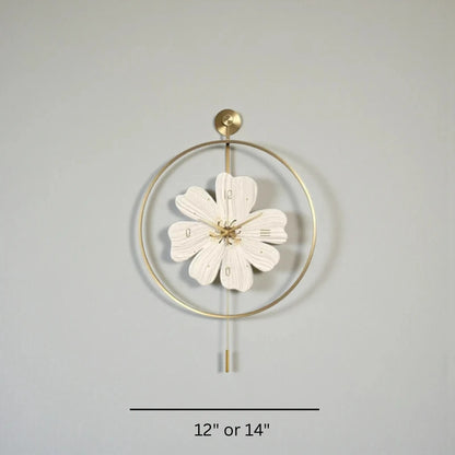 Flower wall clock - Fenton: A gold-framed wall clock with a six-petal flower face and slim pendulum, available in 12″ or 14″. Perfect for adding springtime charm to your decor.