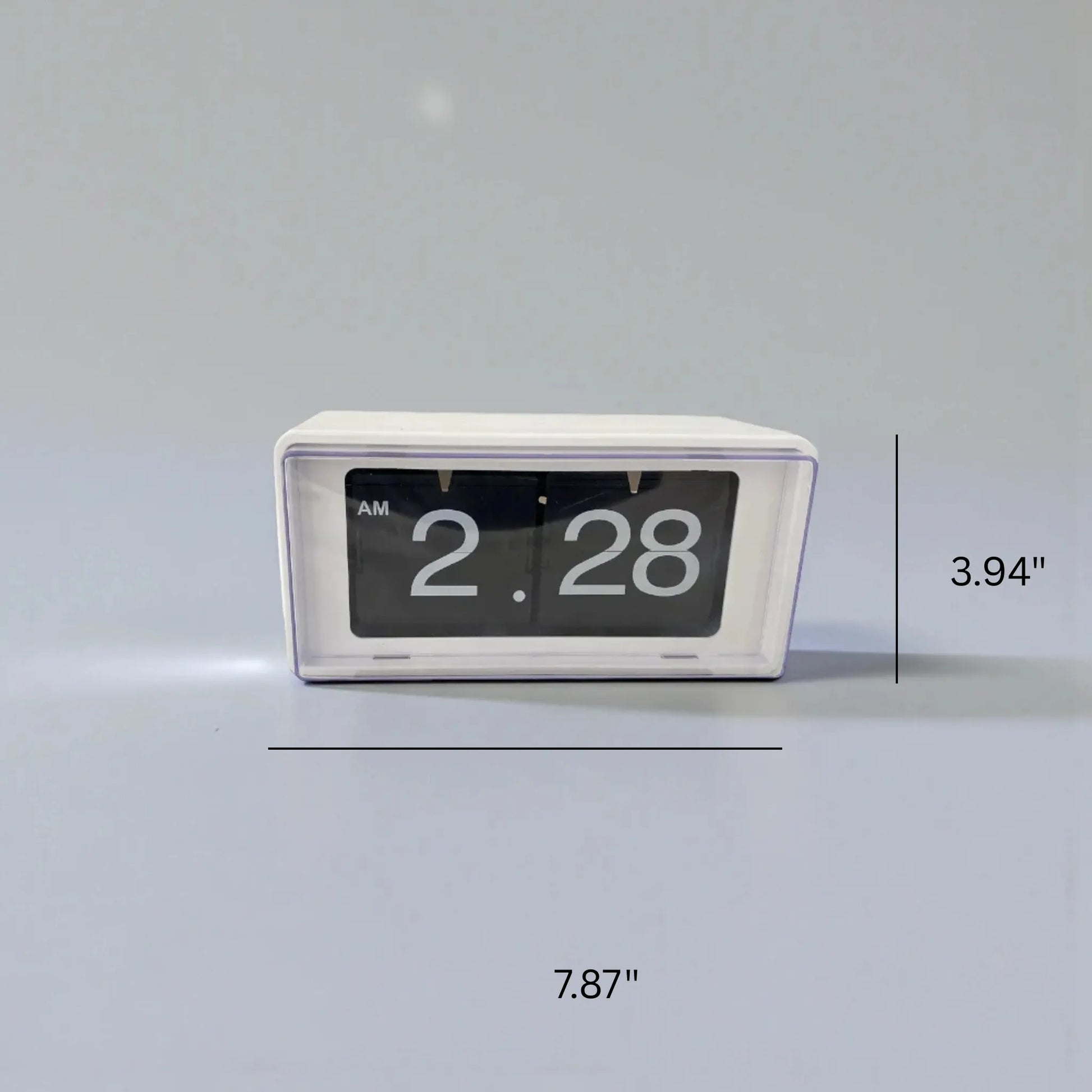 Vintage flip clock - TimeFlip in white plastic housing with a clear window displaying AM 2.28 on black-and-white flipping cards, measuring approximately 7.87″ by 3.94″.