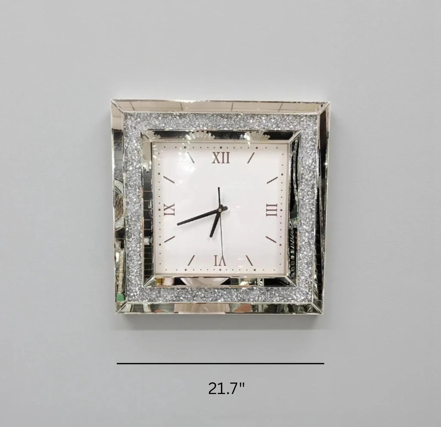 Fancy wall clock - Norwyn, featuring a mirrored frame with glitter inlays, Roman numerals, and black hands, measuring 21.7 inches wide. A striking focal point for any room.