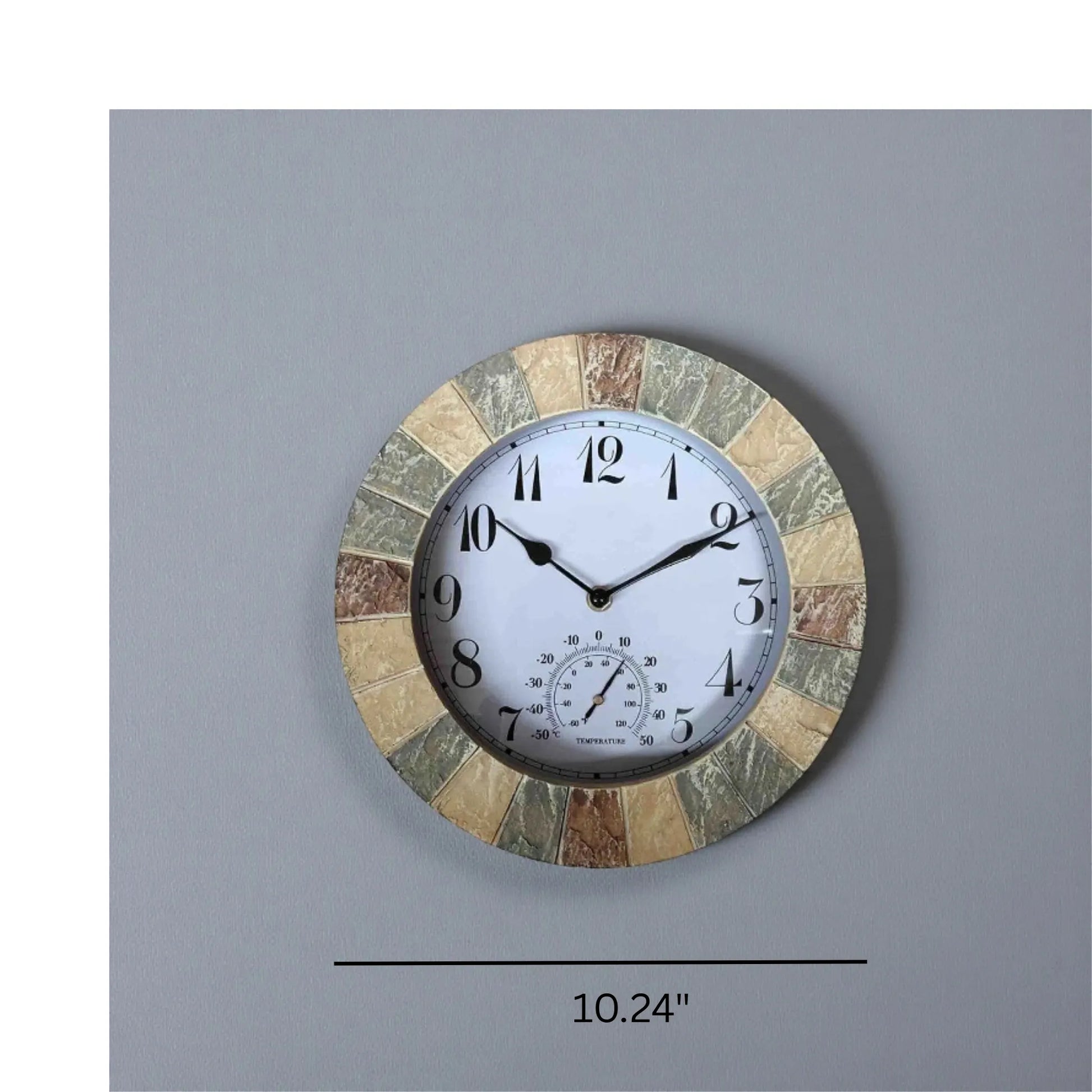 Large outdoor wall clock - Sylva: A 10.2 round clock with a stone-look mosaic frame, featuring an analog display at 10:10 and a thermometer gauge, ideal for patios or gardens.