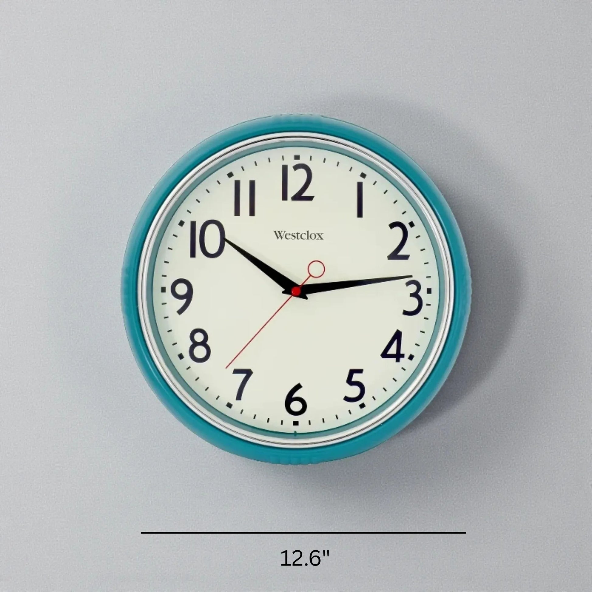 Blue metal Wall Clock - Farlton by Westclox features a teal frame, large black numerals, and bold hands, offering a modern, silent addition to any contemporary home from The Horologista.