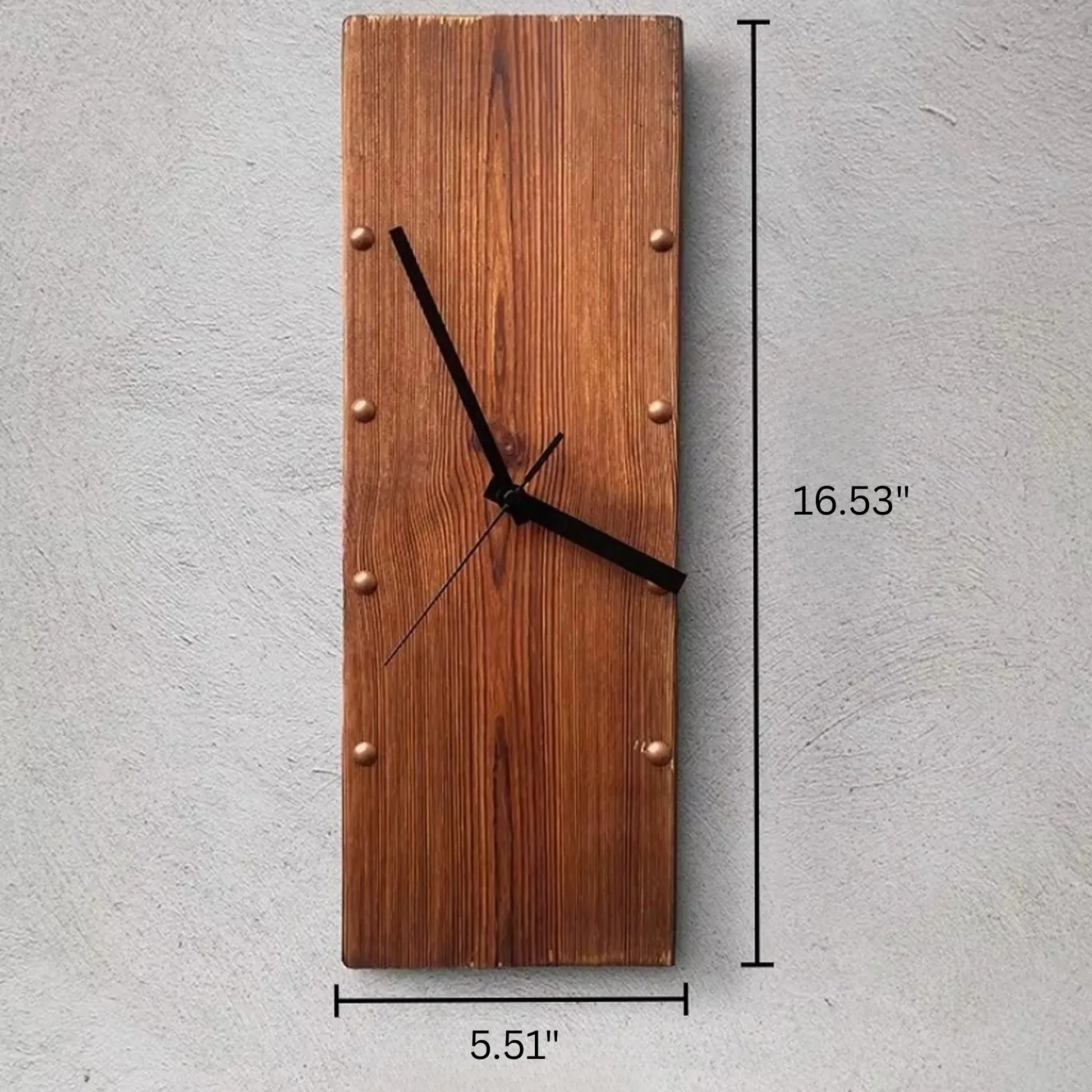 Wood Wall Clock - Stalford: A minimalist clock crafted from a vertical plank of stained wood, featuring metal studs marking hours and simple black hands, perfect for large spaces.