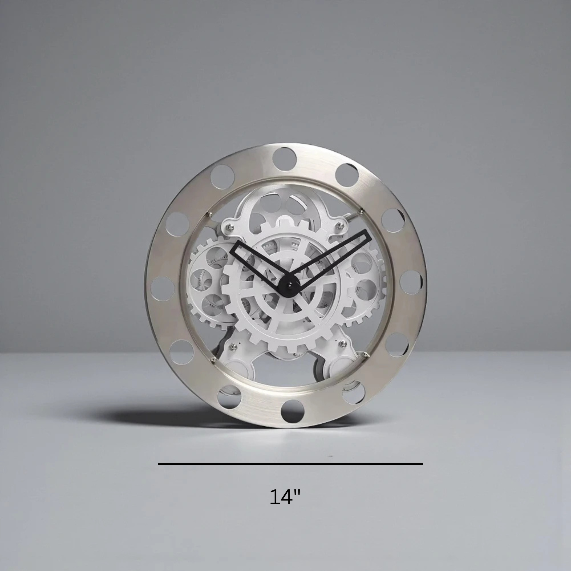Modern Wall Clock Design - Elverton features exposed interlocking gears behind bold Roman markers, framed by riveted gun-metal trim, with black hands on a transparent gear assembly, embodying a stunning mechanical aesthetic.