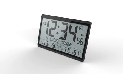 Atomic wall clock - Harven: A freestanding digital clock displaying 12:34 PM, date 14-6-2022, indoor/outdoor temperatures, humidity, and DST active, ensuring precise time with atomic synchronization.