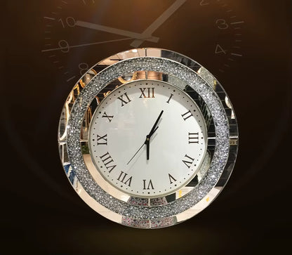 Fancy wall clock - Norwyn features a white dial with black Roman numerals, slim black hands, and a mirrored frame inlaid with sparkling crystals, designed as a room's elegant focal point.