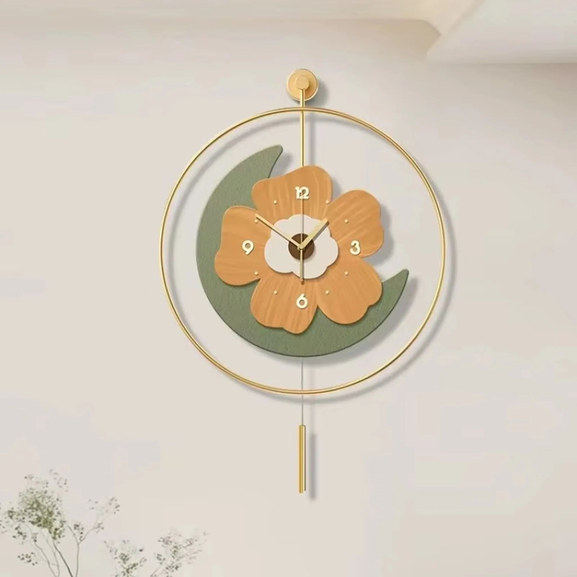 Flower wall clock - Fenton: A stylish clock featuring a flower design with light-wood petals, numbers, and a green crescent, encased in a gold hoop with a matching pendulum, ideal for modern decor.