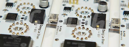 Nixie tube clock - Hartley close-up featuring intricate PCBs with micro-USB, microcontroller, and spring/contact pads, representing The Horologista's blend of vintage tech and modern craftsmanship.