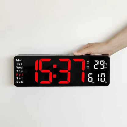 Large digital wall clock - Eldon featuring jumbo LED time display at 15:31, highlighted 'Fri', with temperature 29°C and date 6-10, held against a light background.