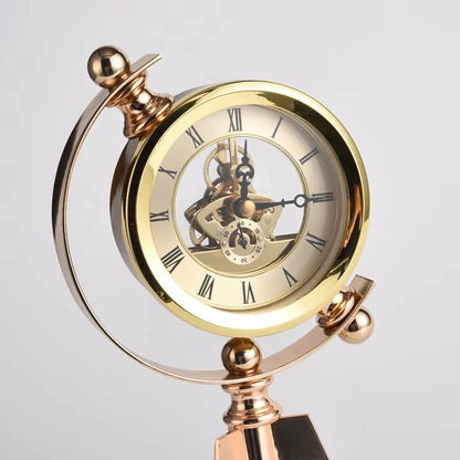 Vintage Table Clock - Gorven: A decorative gold skeleton desk clock featuring exposed gears, Roman numerals, and a sub-dial, elegantly mounted on a metallic stand with polished spheres.