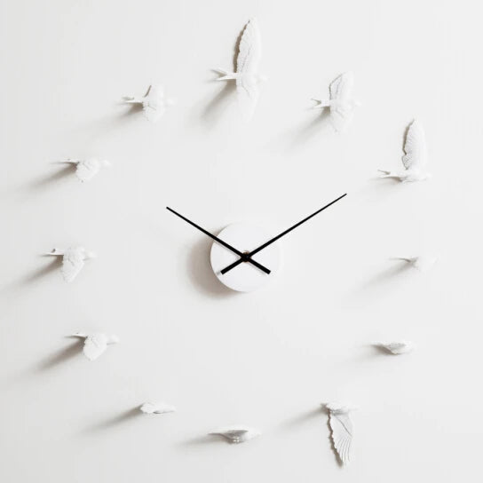 Decorative kitchen wall clocks - Darven: A minimalist design featuring a central clock mechanism with black hands, surrounded by white bird sculptures in place of numerals, ideal for enhancing open kitchen spaces.