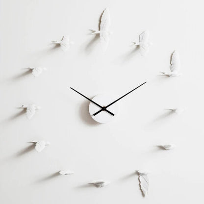 Decorative kitchen wall clocks - Darven: A minimalist design featuring a central clock mechanism with black hands, surrounded by white bird sculptures in place of numerals, ideal for enhancing open kitchen spaces.