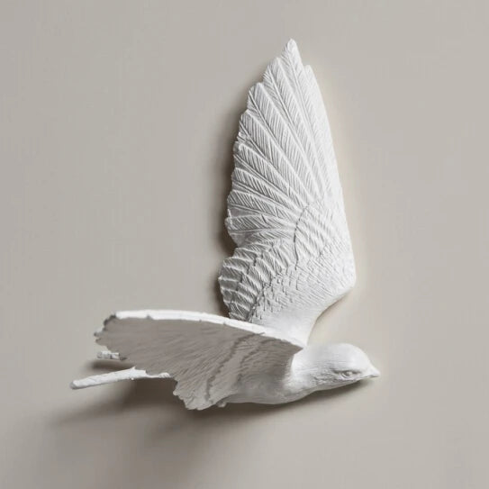 Decorative kitchen wall clocks - Darven features a three-dimensional wall sculpture of a white bird in flight, crafted from plaster or resin, complementing open kitchen spaces with style.