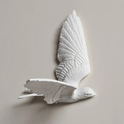 Decorative kitchen wall clocks - Darven features a three-dimensional wall sculpture of a white bird in flight, crafted from plaster or resin, complementing open kitchen spaces with style.