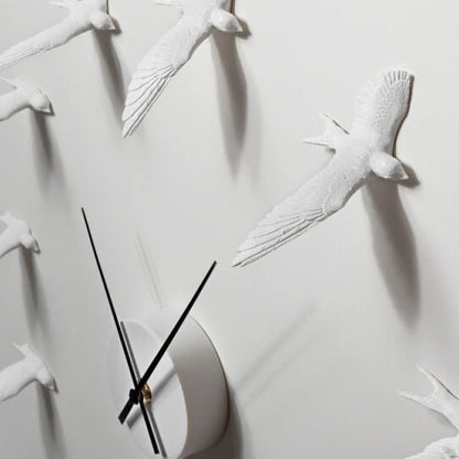 Decorative kitchen wall clocks - Darven features a flock of sculpted birds forming the clock face, with slim black hands indicating time, perfect for enhancing open kitchen spaces with artistic flair.