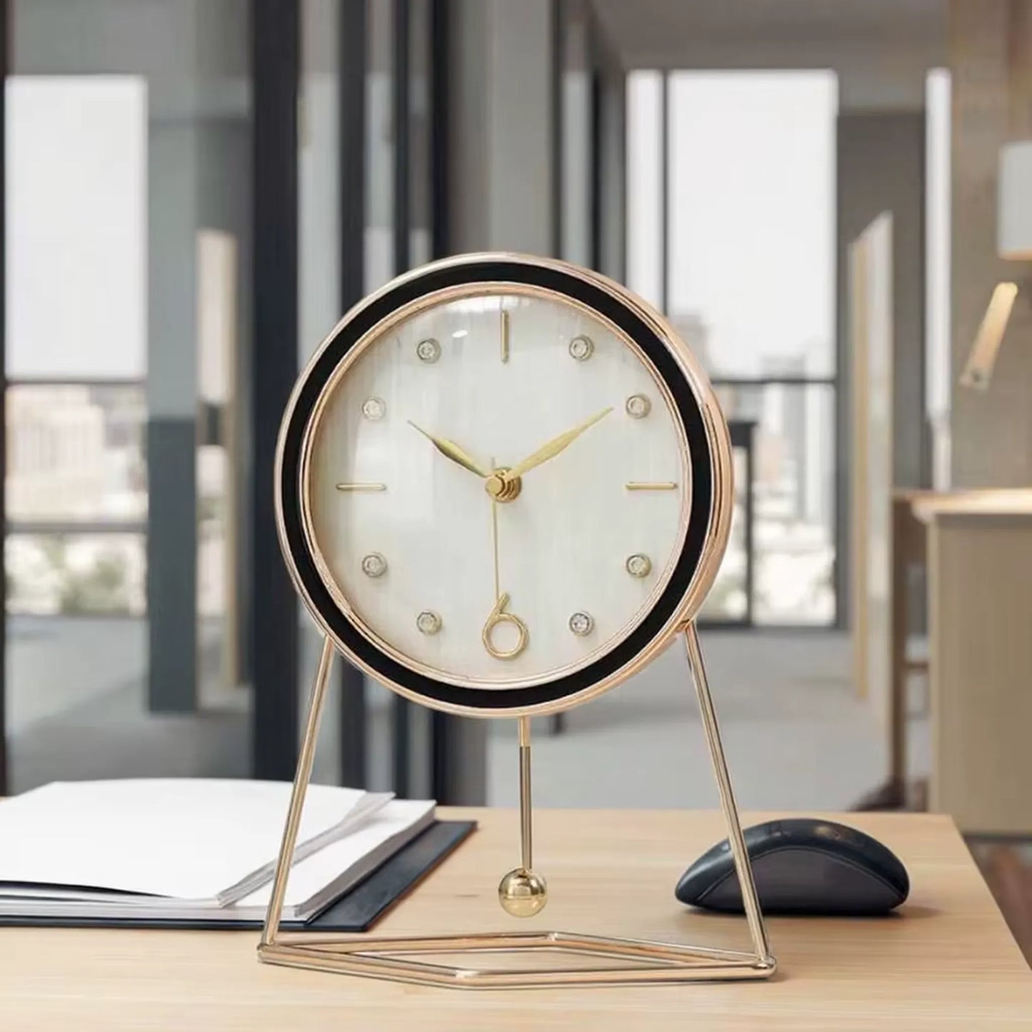 Pendulum Table Clock - Dralen: A minimalist mid-century desk clock with a brass frame, gold hands, and a swinging pendulum, perfect for adding elegance to any modern workspace.