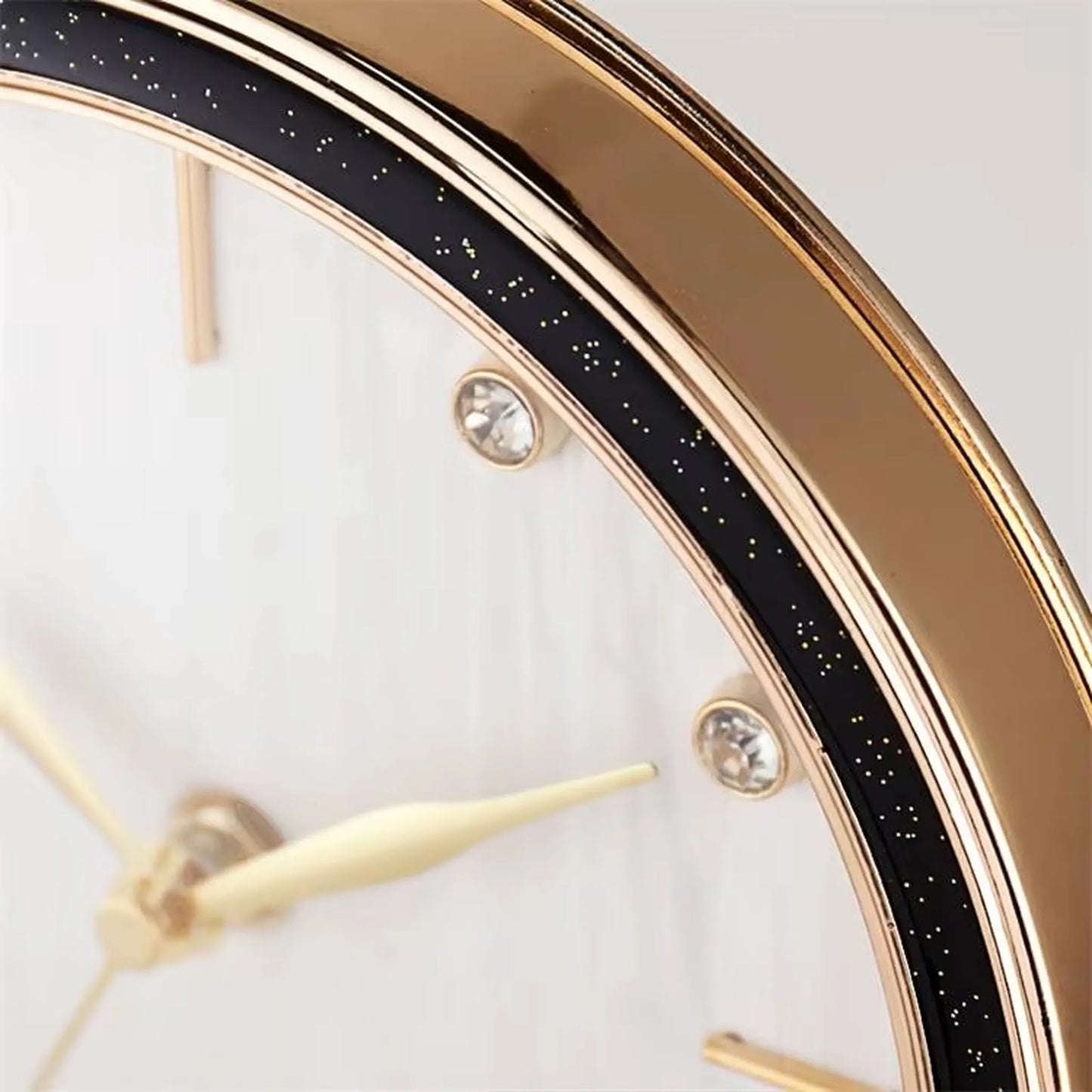 Pendulum Table Clock - Dralen features a gold-tone bezel, crystal-style hour studs, and slender cream hands. Its open-concept design and swinging pendulum create dynamic elegance for your mantel or desk.