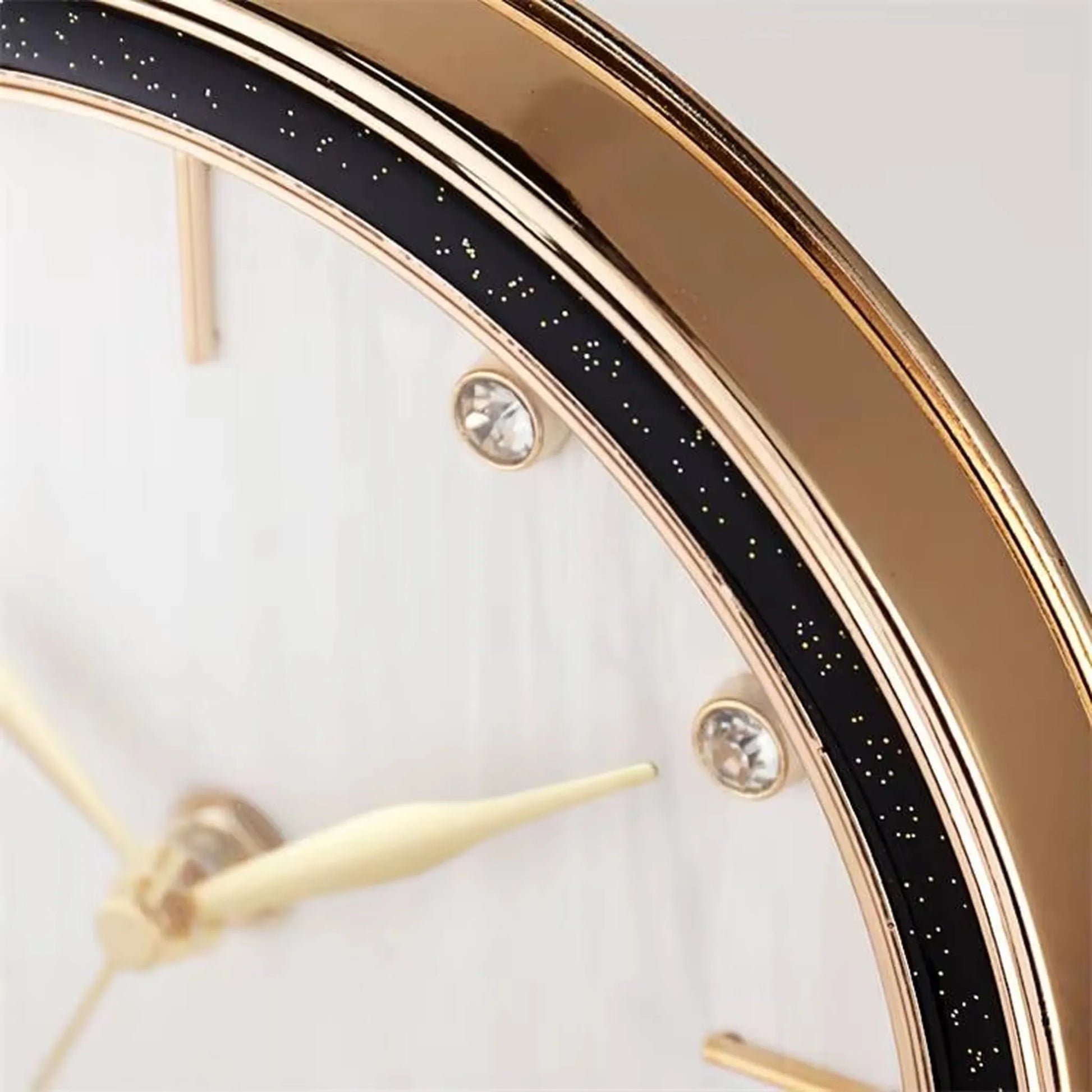 Pendulum Table Clock - Dralen features a gold-tone bezel, crystal-style hour studs, and slender cream hands. Its open-concept design and swinging pendulum create dynamic elegance for your mantel or desk.