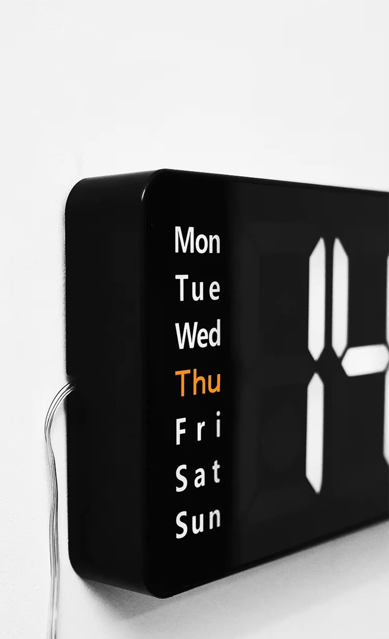 Large digital wall clock - Eldon: close-up view showing illuminated Thu for Thursday, sleek black casing, partial LED time display, ideal for large spaces with jumbo numbers and remote control.