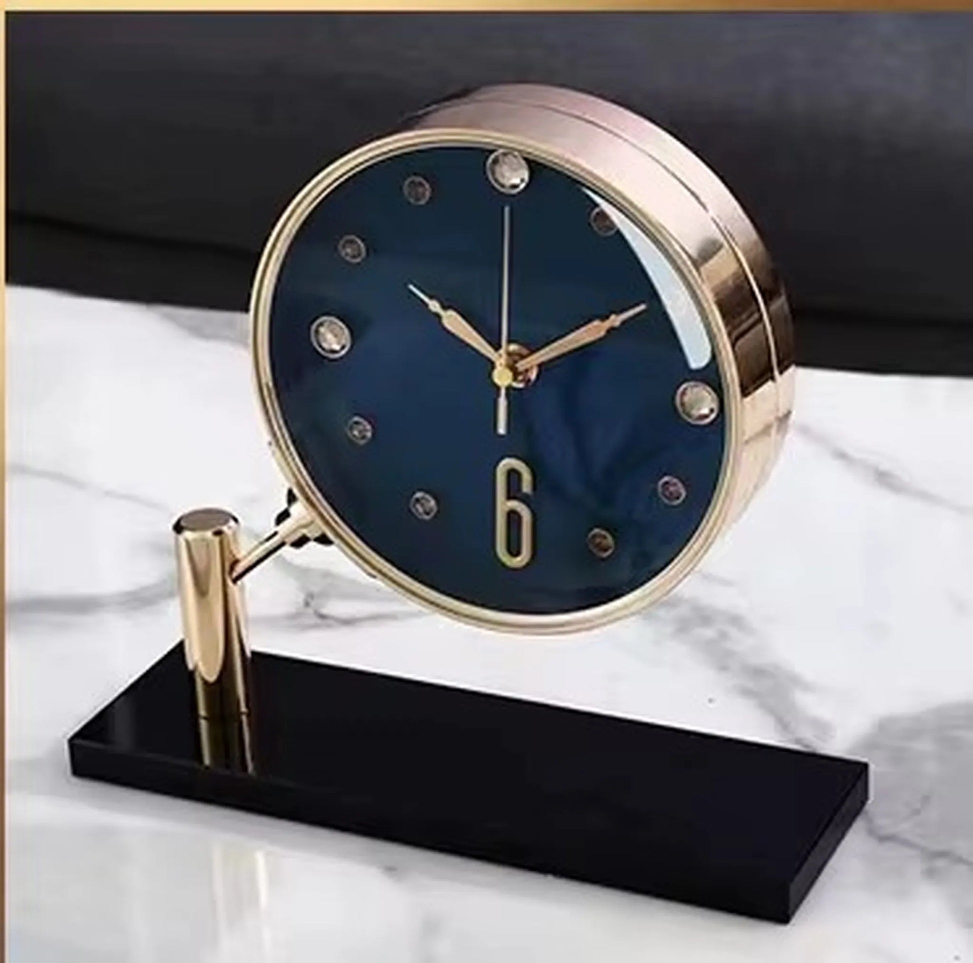 Luxury Table Clock - Corlen: A modern desk clock with a navy-blue face, gold case, crystal markers, and a black base, adding elegance to any home or office decor.