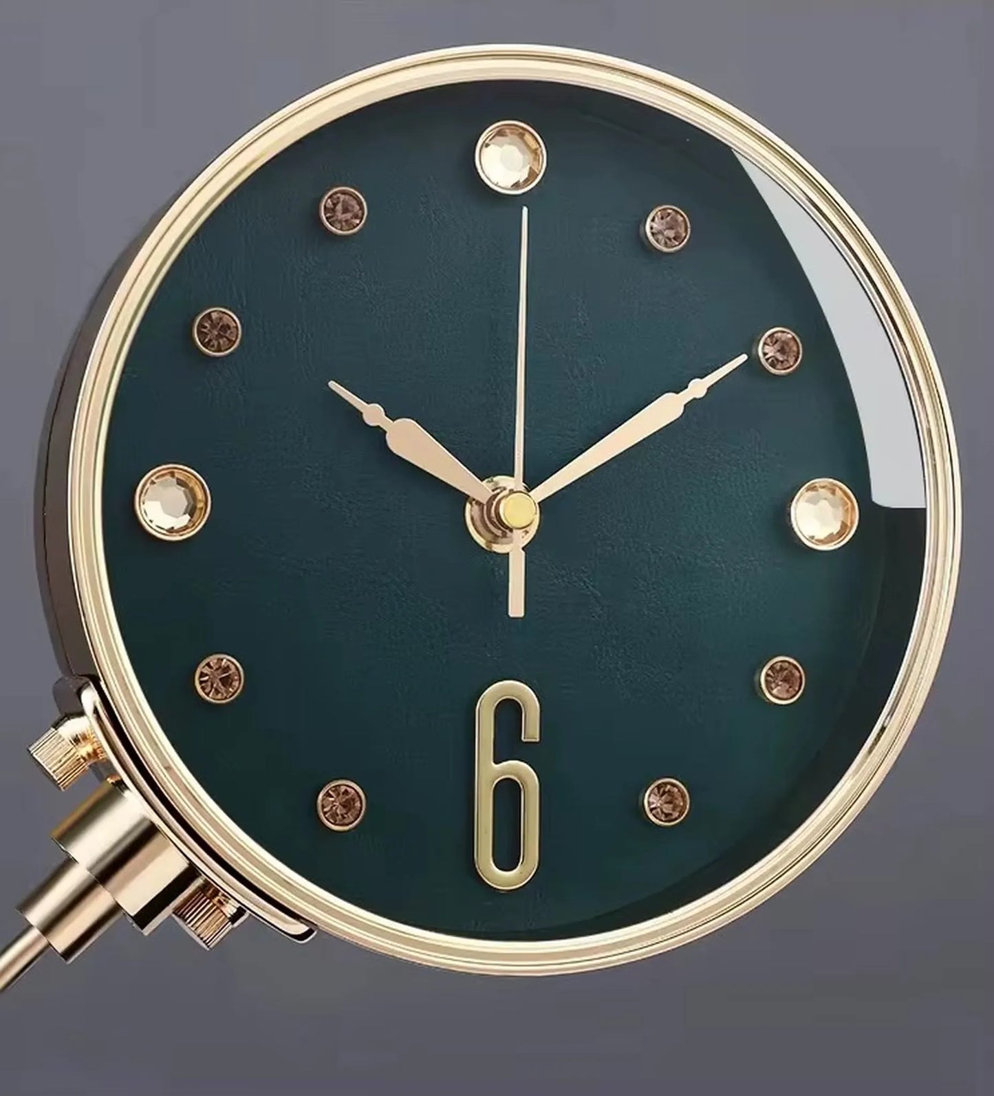 Luxury Table Clock - Corlen: A close-up of this elegant table clock showcases its dark teal face, gold bezel and hands, and crystal-style markers, ideal for enhancing modern home or office decor.