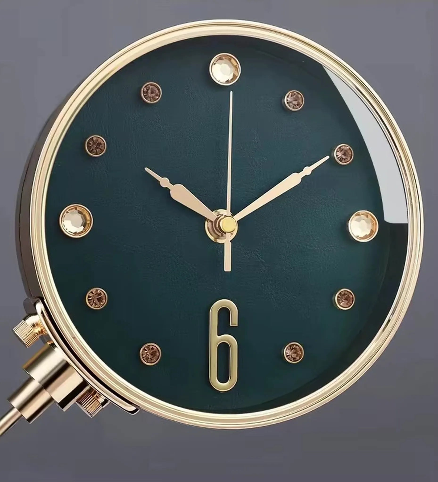 Luxury Table Clock - Corlen: A close-up of this elegant table clock showcases its dark teal face, gold bezel and hands, and crystal-style markers, ideal for enhancing modern home or office decor.