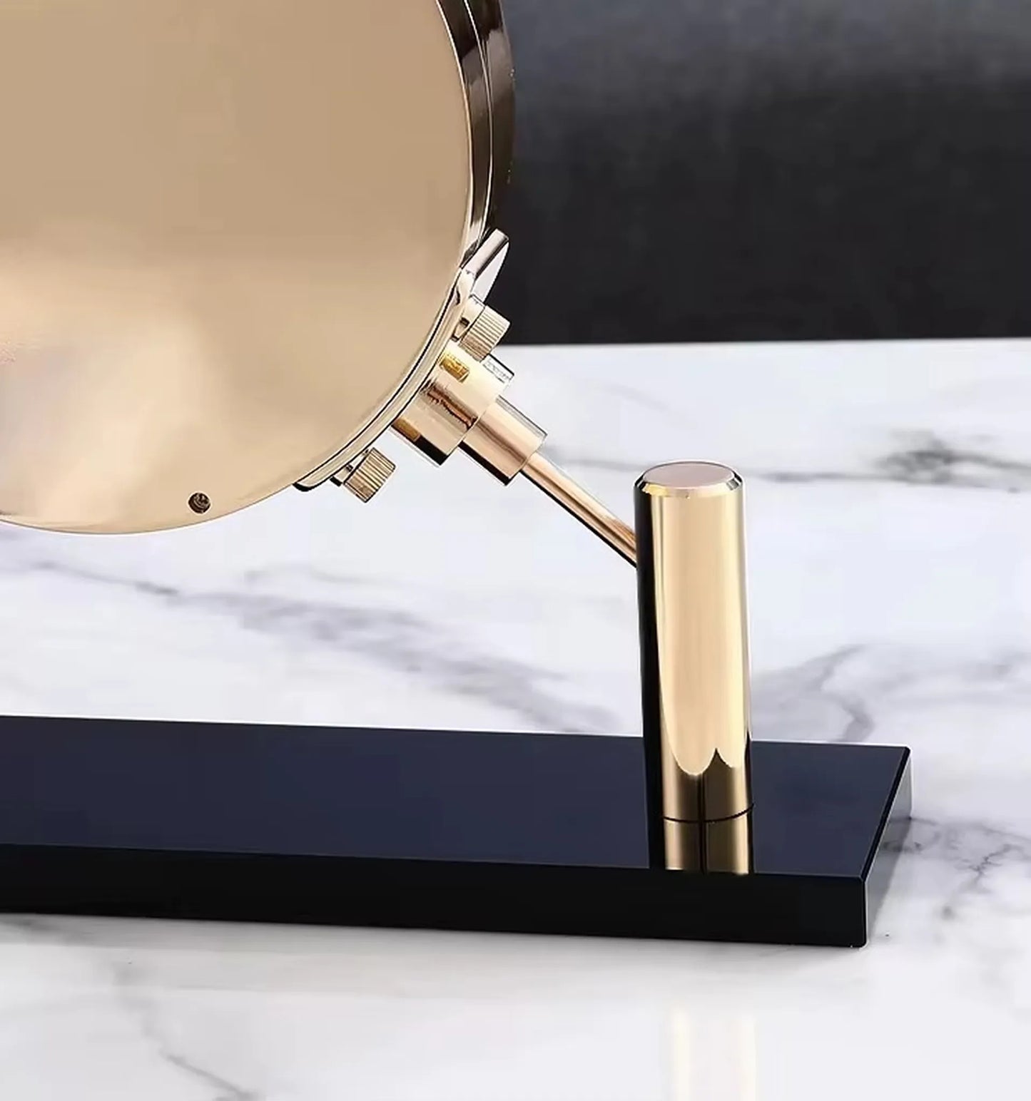 Luxury Table Clock - Corlen: A round, gold-metal clock with an elegant stem and base, set on a white marble surface, embodying modern sophistication and style.