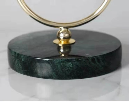 Pendulum Table Clock - Leiton with a polished brass ring atop a dark marble base, designed for elegant mantel or desk display, showcasing unique, open-concept timekeeping from The Horologista.