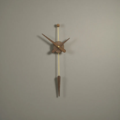 Mid century modern wall clock - Ellroy, featuring a minimalist design with a wooden clock face and hands on a brass-finished rod, accented by a wooden sphere and pendulum weight.