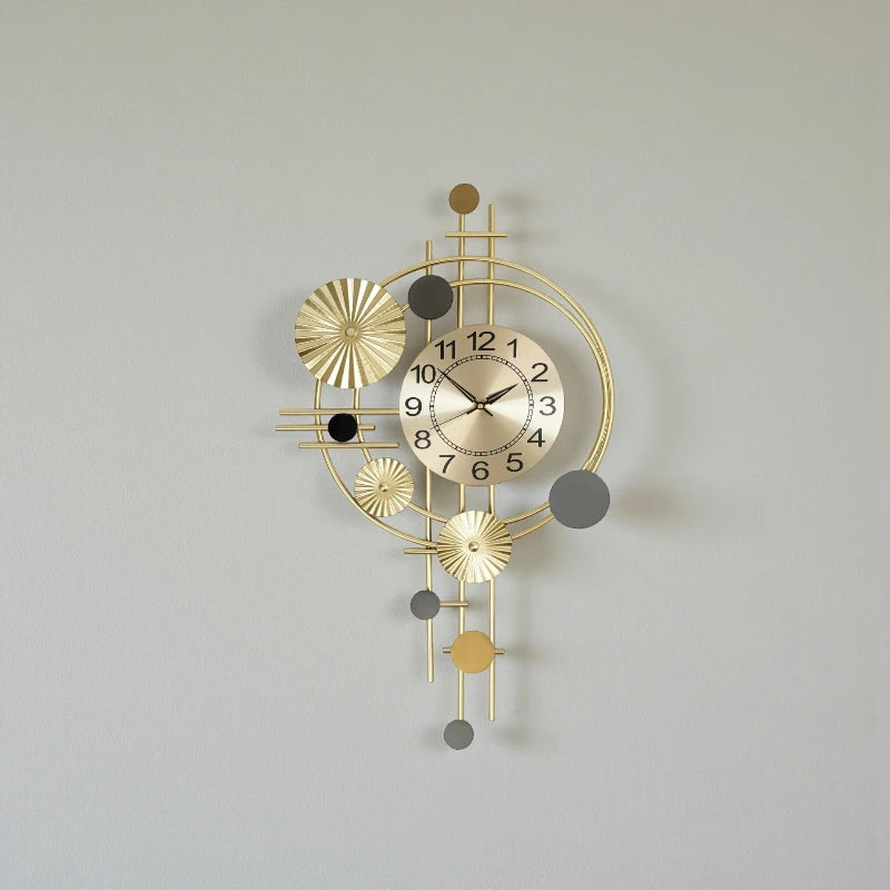Oversized wall clock modern - Hashford features a gold metallic face with black numerals and brass hands, complemented by geometric metal rings and discs, offering a sculptural, contemporary design.