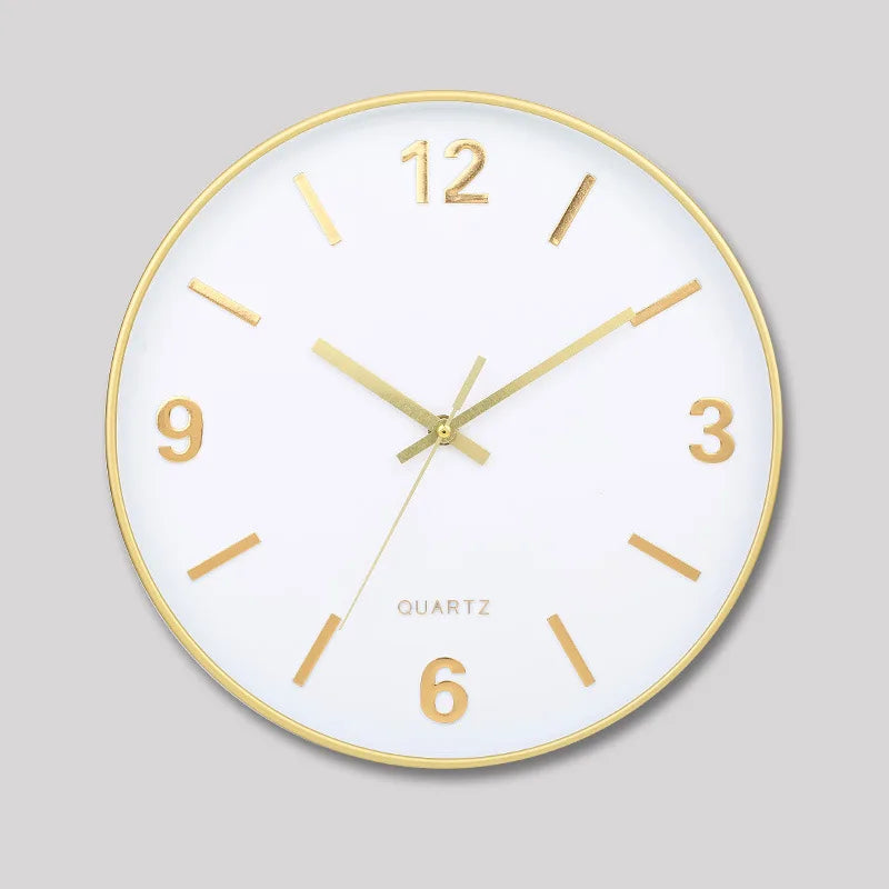 Modern Silent Wall Clock - Densford: A sleek round analog clock with a white face, gold accents, and silent quartz movement. Features minimalist gold hour markers and hands, set to 10:10.