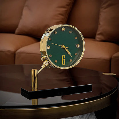 Luxury Table Clock - Corlen: A modern table clock with a green face, gold hands, and a gold-plated bezel, elegantly positioned on a coffee table, enhancing the decor with its sophisticated design.