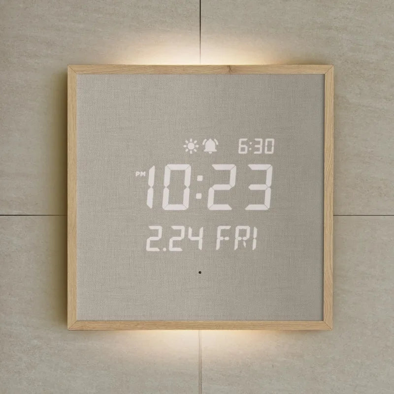 Modern Digital Wall Clock - Belcroft: A minimalist wall-mounted clock with a backlit LED display showing PM 10:23 and 2.24 FRI, framed in light wood, blending art with functionality.