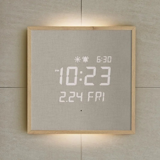 Modern Digital Wall Clock - Belcroft: A minimalist wall-mounted clock with a backlit LED display showing PM 10:23 and 2.24 FRI, framed in light wood, blending art with functionality.