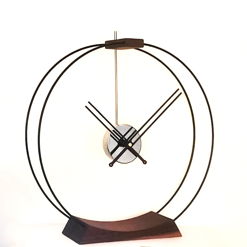 Design table clock - Bexley: A minimalist timepiece with black metal hoops and exposed clock hands, creating an open-frame, sculptural design. Perfect for adding a contemporary touch to any desk or shelf.