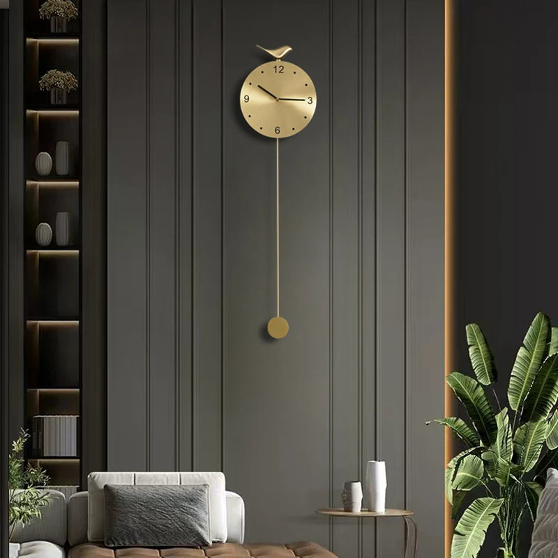 Modern pendulum wall clock - Majesty: A slim, gold-finished clock with a bird silhouette centerpiece, enhancing a stylish dark gray panelled wall, perfect for elevating contemporary decor in The Horologista collection.