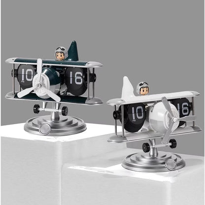 Aviation-themed flip clock with propeller and landing gear