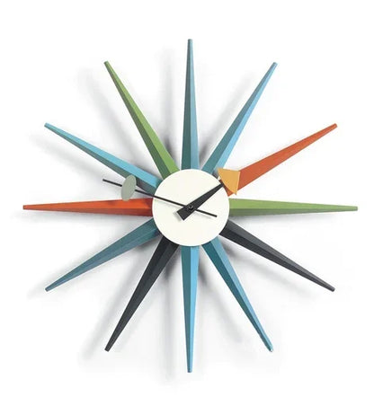 Rovell features a small round face with simple hands and colorful spokes, embodying mid-century modern style, perfect for adding a classic touch to your home decor.